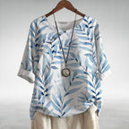 Capri - Women's Leaf-Print Blouse with Asymmetric Button Detail